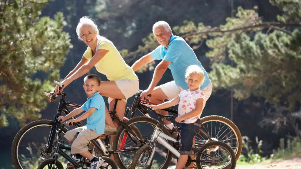 A group of older people cycling together outdoors