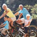 A group of older people cycling together outdoors